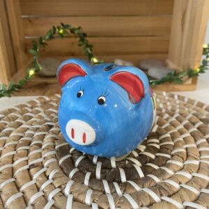 Tirelire cochon en céramique bleue décorée de maisons